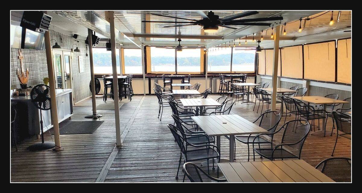 Outdoor patio dining above Lakeshore Marina