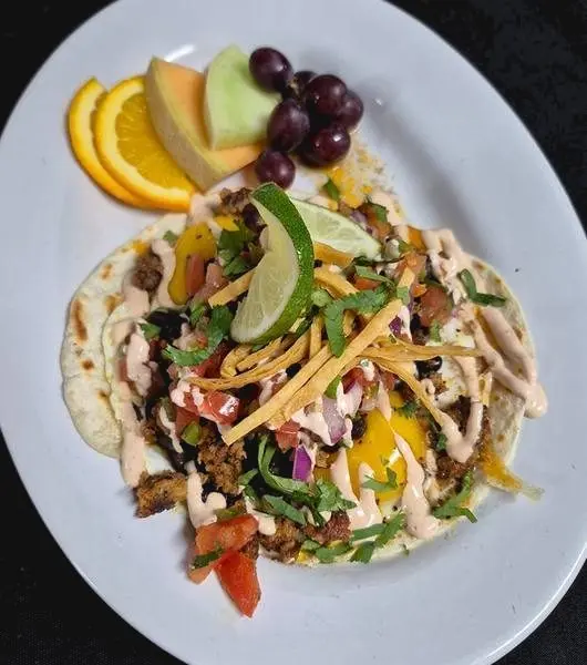 Huevos Rancheros with chorizo and chipotle crema